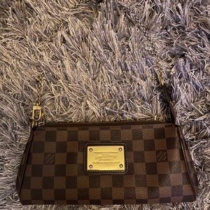 Authentic Louis Vuitton Eva Clutch Bag